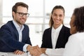 Happy hr handshaking hiring successful job candidate at business interview Royalty Free Stock Photo