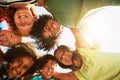 Happy, huddle and portrait of kids in park for bonding, playing and fun together outdoors. Diversity, youth and low Royalty Free Stock Photo