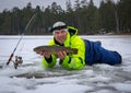 Happy angler fishing on the ice Royalty Free Stock Photo