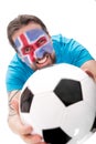 Happy icelandic soccer fan with a football