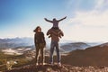 Happy idyllic family against mountains is having fun