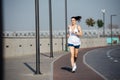 Happy immersed athletic woman running on the new track outdoors. Royalty Free Stock Photo