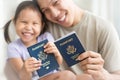 Happy immigrant family becoming new American citizens, holding US passports Royalty Free Stock Photo