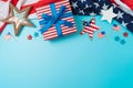 Happy Independence Day, 4th of July border background with gift box, stars and USA flag. Top view, flat lay Royalty Free Stock Photo