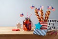 Happy Independence Day, 4th of July celebration concept with summer fresh fruit drink, twisted hot dog sausages and USA flag on Royalty Free Stock Photo