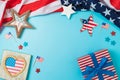 Happy Independence Day, 4th of July patriotic frame border background with gift box, stars and USA flag. Top view, flat lay Royalty Free Stock Photo