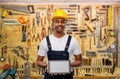 Happy indian builder in helmet with tablet pc Royalty Free Stock Photo