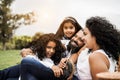 Happy indian family having fun at city park painting and laughing together - Parents and children enjoying summer day outdoor - Royalty Free Stock Photo