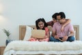 Happy indian family teenage boy son and girl with dad smiling, relaxing and using laptop together at home, single father Royalty Free Stock Photo