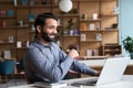 Happy indian man having video conference call virtual business meeting.