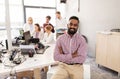 Happy indian man over creative team in office Royalty Free Stock Photo