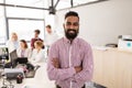 Happy indian man over creative team in office Royalty Free Stock Photo