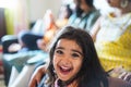 Happy indian toddler wearing sari dress at home with her family - Focus on girl face