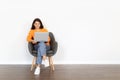 Happy indian woman digital nomad working on laptop, copy space Royalty Free Stock Photo