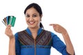 Happy Indian woman holding a bunch of debit cards