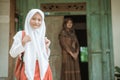 Happy indonesian student getting ready to school