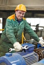 Happy industry worker repairman with spanner Royalty Free Stock Photo