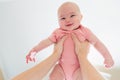 Happy infant baby girl being held up in the air Royalty Free Stock Photo