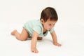 happy infant crawling on floor inside baby playpen Royalty Free Stock Photo