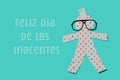 Happy innocents day in spanish and paper doll