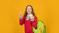 happy inspired with idea teen girl with school backpack on yellow background, school