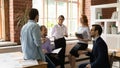 Happy inspired young mixed race colleagues discussing business ideas. Royalty Free Stock Photo