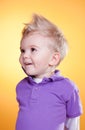 Happy interested little boy in violet Royalty Free Stock Photo