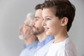 Child boy grandson stand in row with father and grandfather Royalty Free Stock Photo