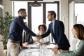 Happy international businessmen handshake at office business meeting Royalty Free Stock Photo