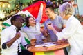 Excited multiracial soccer fans with flag of Mexico celebrating victory with pint of beer in the pub Royalty Free Stock Photo