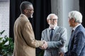 happy interracial business partners shaking hands Royalty Free Stock Photo