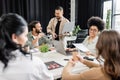 happy interracial business team talking to Royalty Free Stock Photo