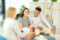 Happy interracial couple with real estate agent in office Royalty Free Stock Photo