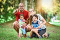 Happy interracial family is enjoying a day in the park Royalty Free Stock Photo