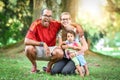 Happy interracial family is enjoying a day in the park Royalty Free Stock Photo