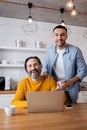 happy interracial father and son laughing