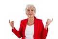 Happy isolated older woman in red cheerful and happy about her s Royalty Free Stock Photo