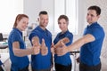 Happy Janitors Showing Thumb Up Sign Royalty Free Stock Photo