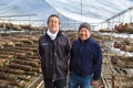 Happy Japanese Shitake mushroom farmers in their mushroom farm i