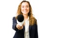 Hispanic woman smiling while doing a news interview