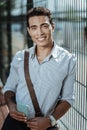 Happy jovial guy awaiting friend near fence