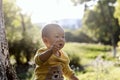 Happy joyful Asia Chinese little boy toddler child enjoy Spring have fun outside embrace nature outdoor carefree childhood meadow Royalty Free Stock Photo