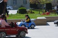 Happy and joyful children ride cars in park