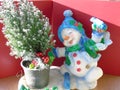 Happy joyful Christmas snowman skating round a xmas tree Royalty Free Stock Photo