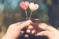 Happy joyful couple give heart candle to each other in the afternoon, Love concept