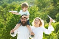 Happy joyful family having fun throws up in the air little boy child. Mother father and son. Concept of friendly family Royalty Free Stock Photo