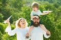 Happy joyful family having fun throws up in the air little boy child. Mother father and son. Concept of friendly family Royalty Free Stock Photo