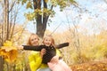 Happy joyful family portrait mother and daughter in autumn forest Royalty Free Stock Photo