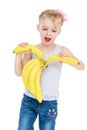 Happy joyful girl holding a bunch of bananas Royalty Free Stock Photo