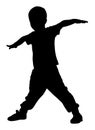 Happy joyful kid, little boy doing exercises , silhouette.